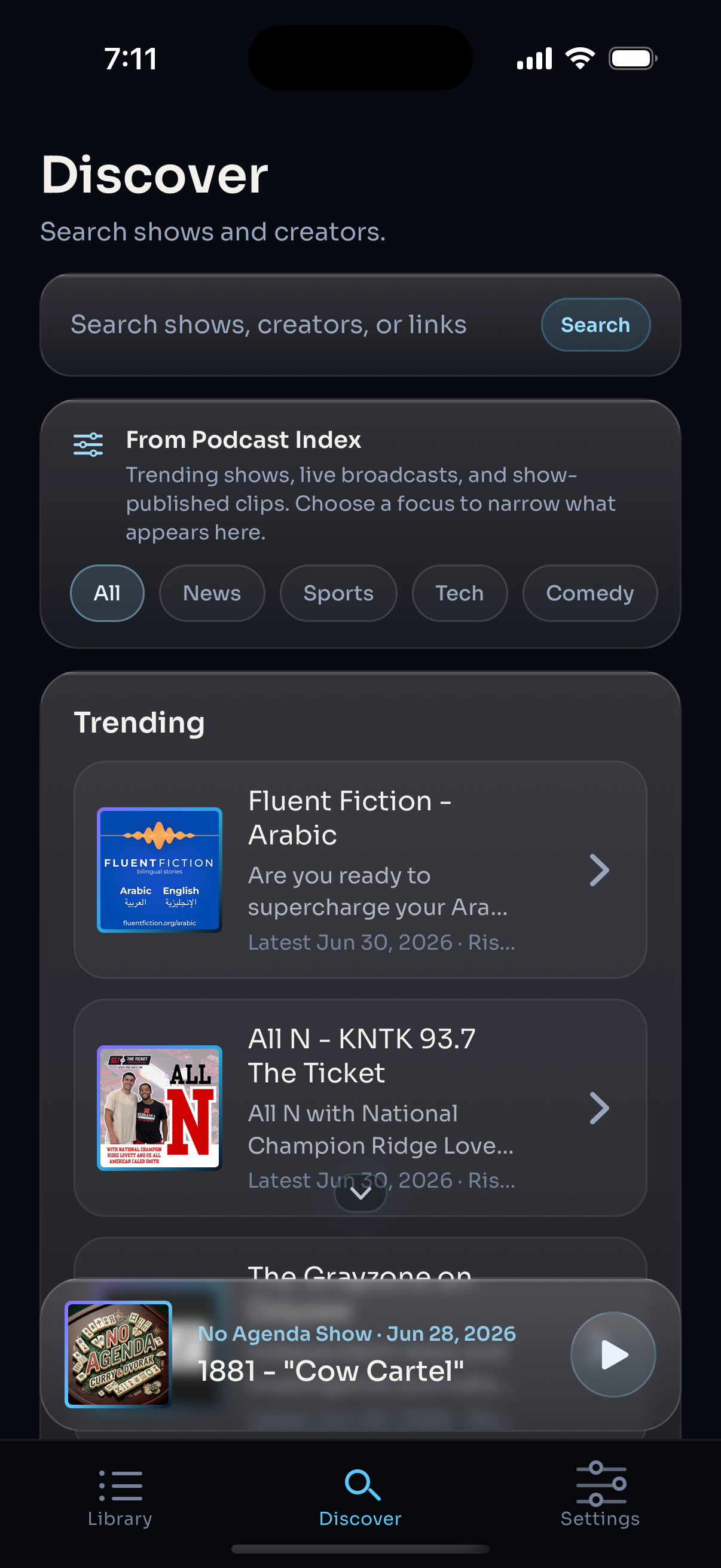 Vibral Discover screen showing Podcast Index search, trending shows, and live podcast discovery.